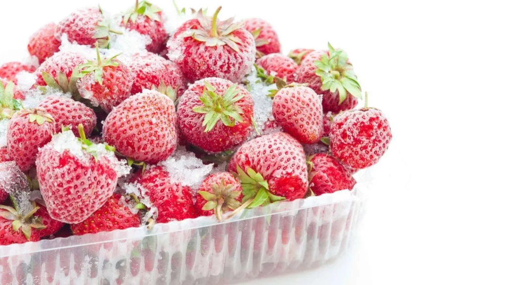 Frozen strawberries covered in frost
